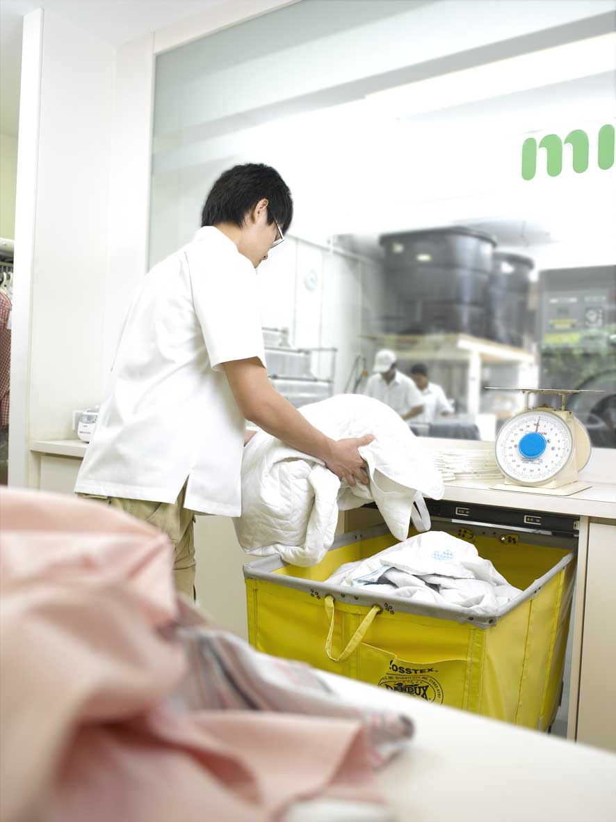 wet cleaning page mr clean staff is sorting laundry