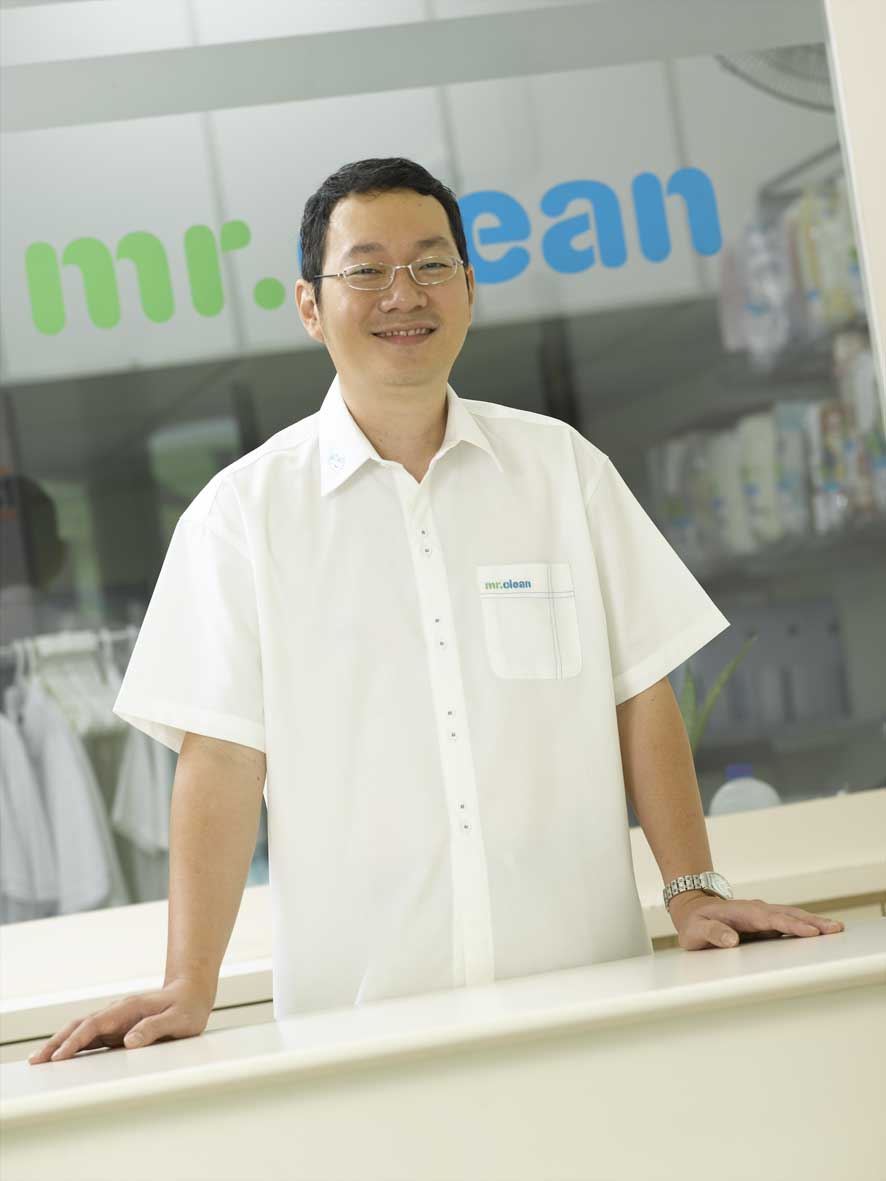 reception mr clean staff smiling at reception in laundry shop