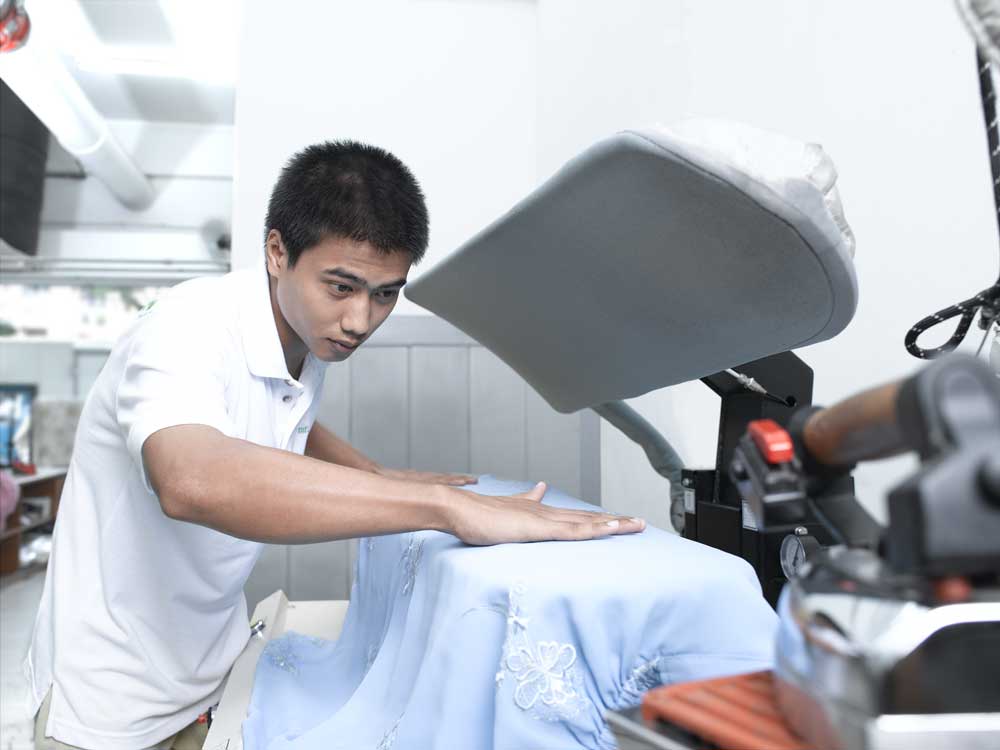 laundry worker doing ironing