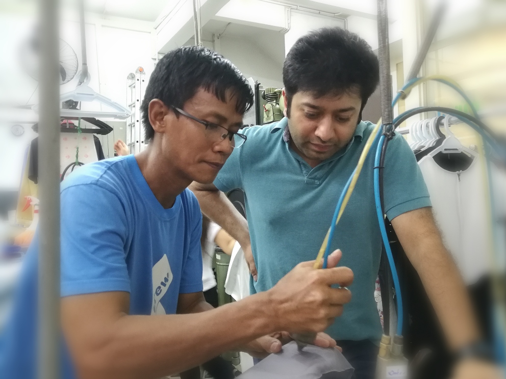 mr clean staff shows the student on stain removal