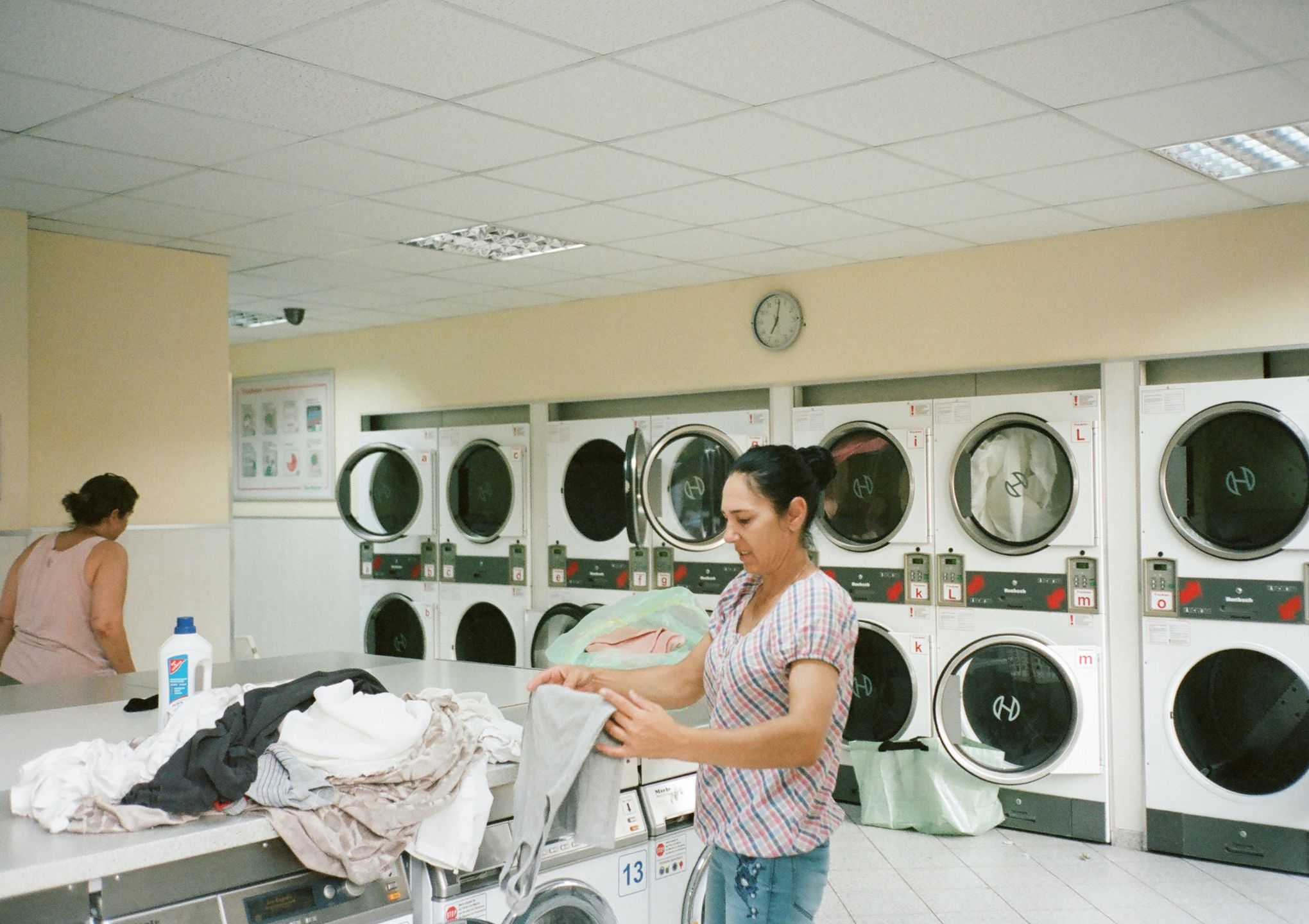 customers are doing their laundry in the coin laundry shop - Post Featured Image