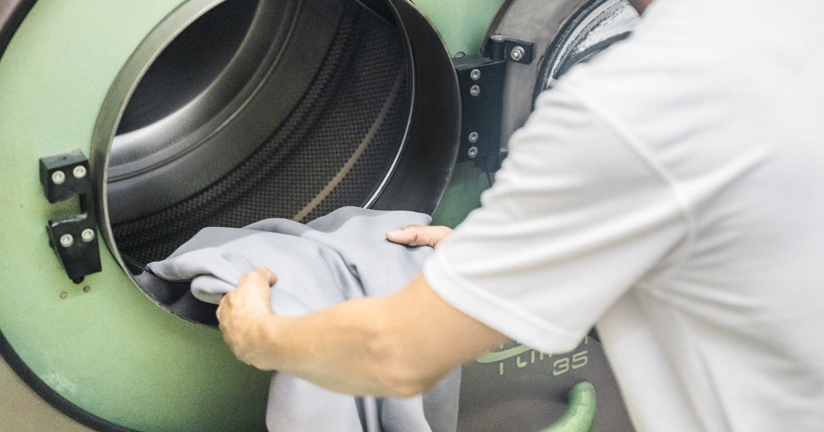 staff putting the curtain into the dry cleaning machine – facebook staff putting the curtain into the dry cleaning machine - facebook